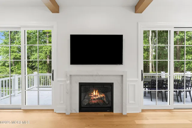 a kitchen with stainless steel appliances granite countertop a sink a stove a dining table and chairs