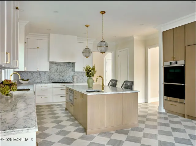 a dining room with furniture a chandelier and wooden floor