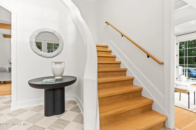 a bath tub sitting in a bathroom next to a sink
