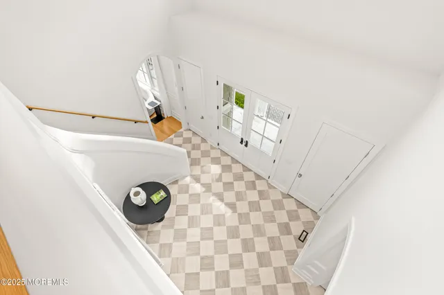 a view of a bathroom with a sink and a mirror
