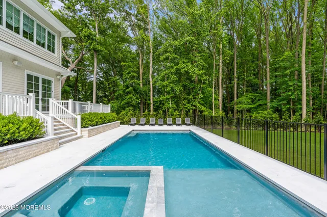 a view of balcony with chairs and a potted plant