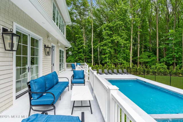 a front view of a building with a garden