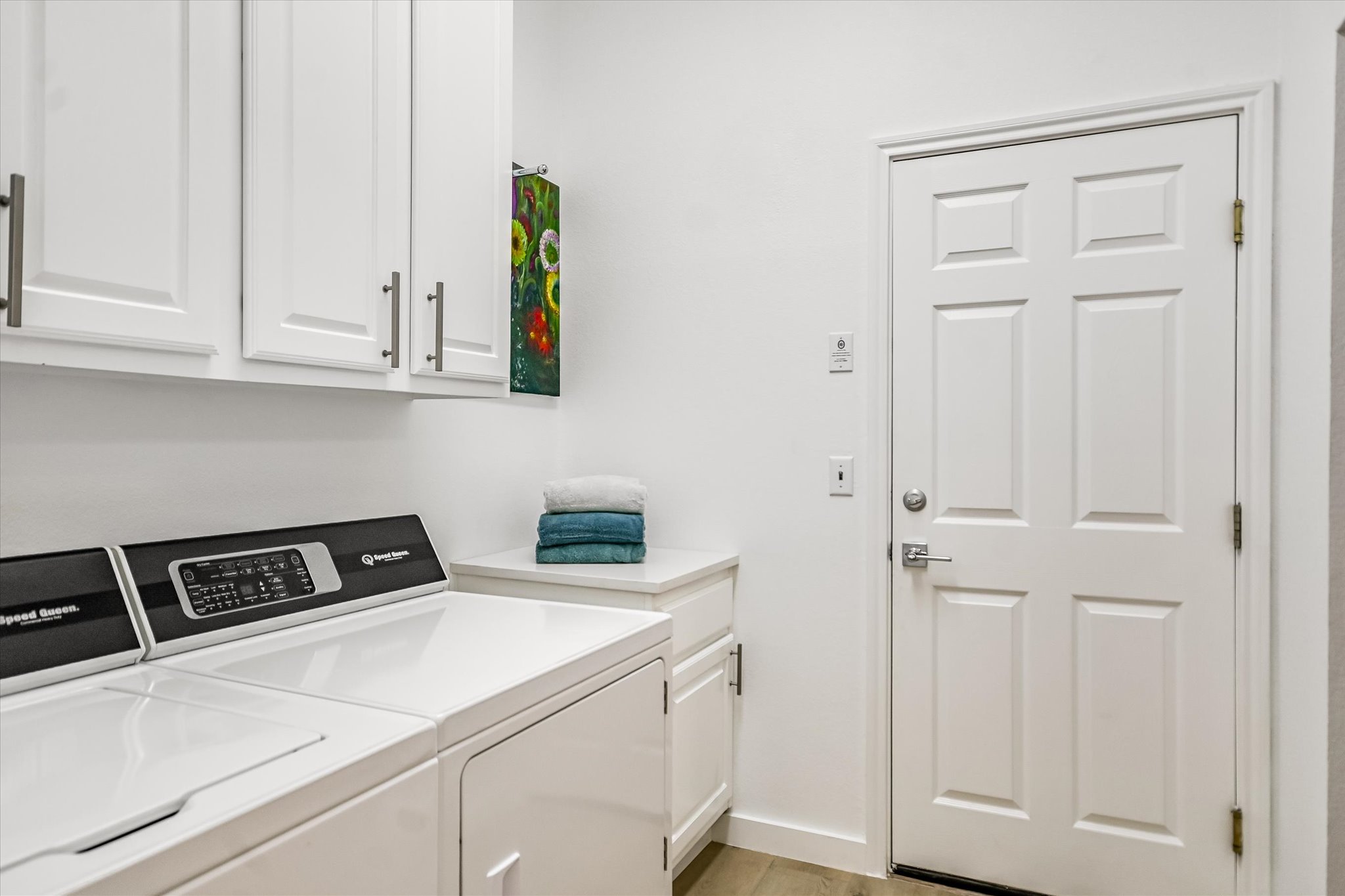 105 Stetson Circle Georgetown, TX 78633 - Photo 9 of 21 Laundry room includes cabinet storage and easy access to garage.