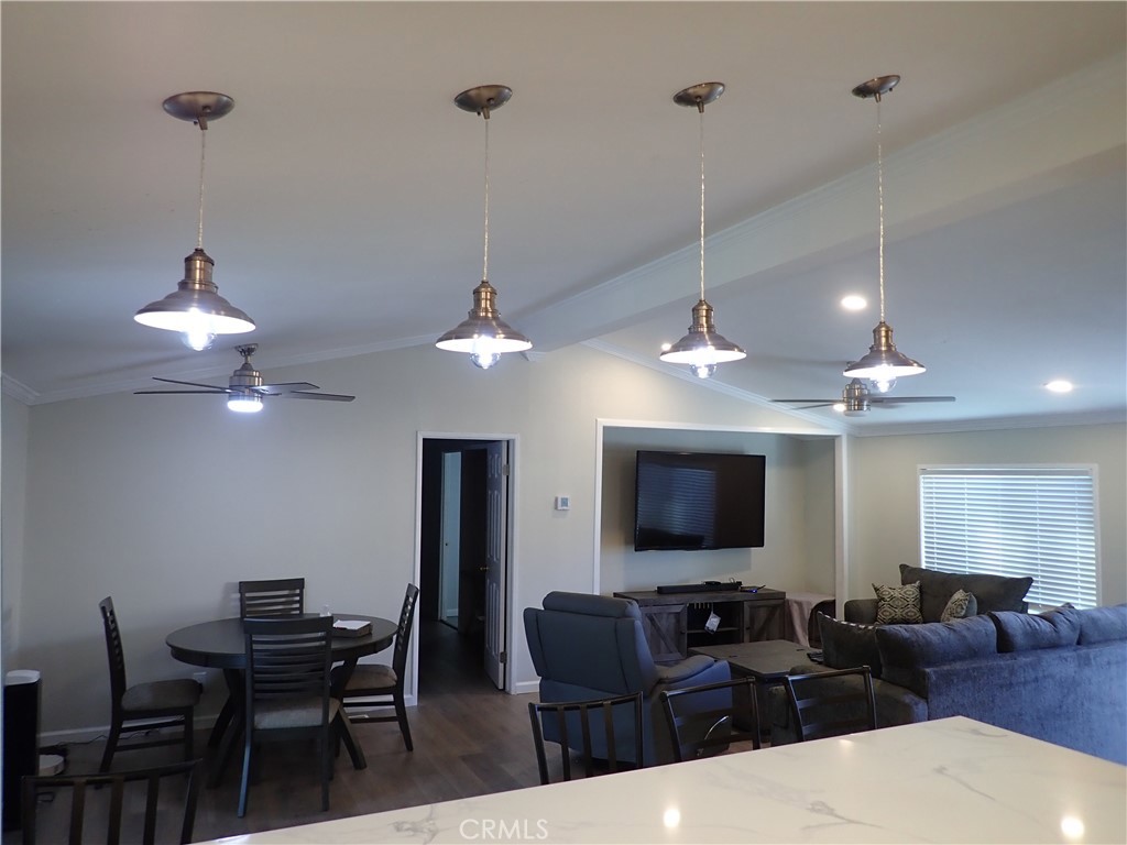 27250 Murrieta Road, Unit 386 Menifee, CA 92586 - Photo 11 of 32 a living room with furniture a ceiling fan and a window
