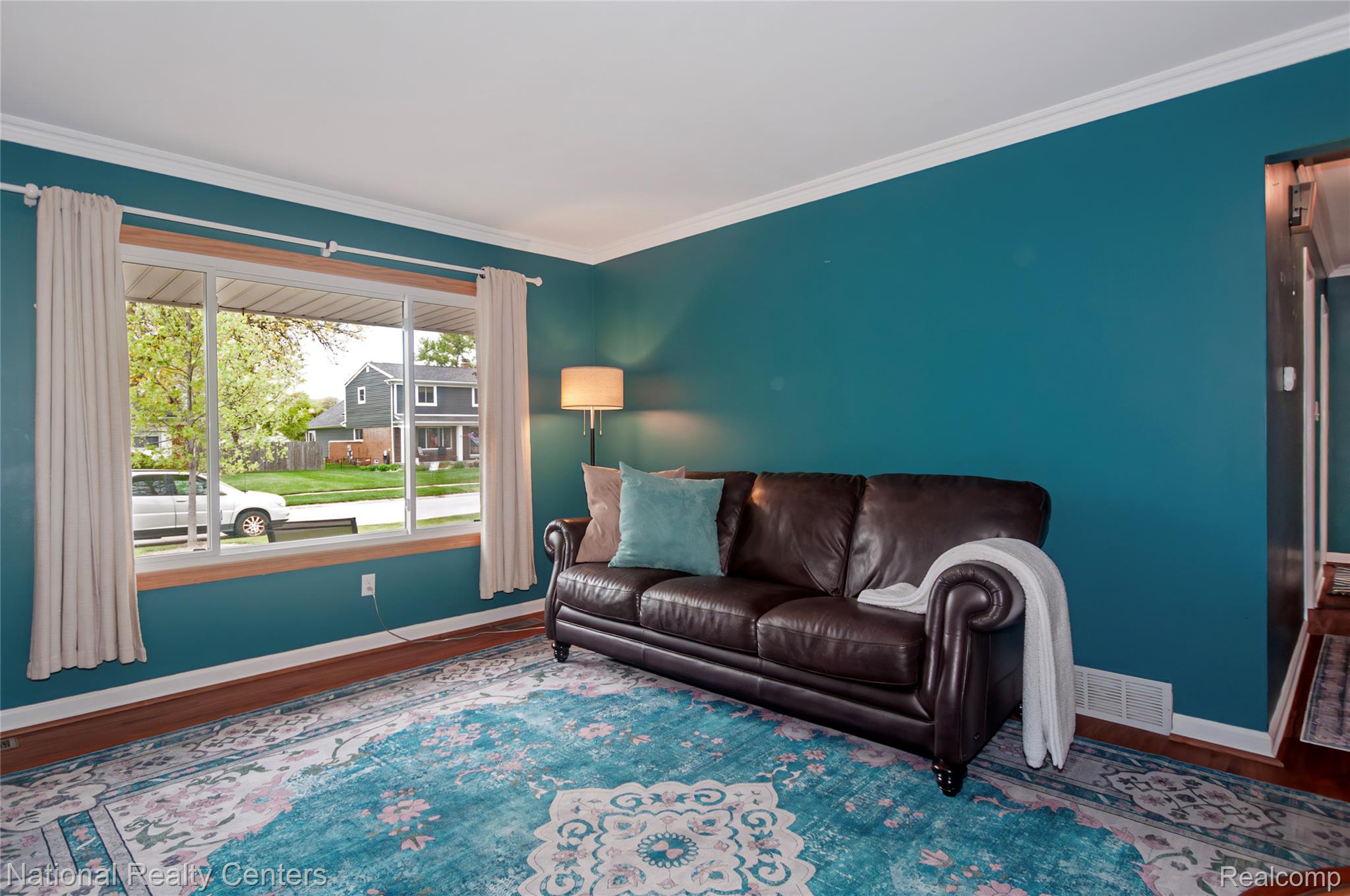 2446 Milverton Road Troy, MI 48083 - Photo 6 of 41 Living area with wood finished floors and crown molding