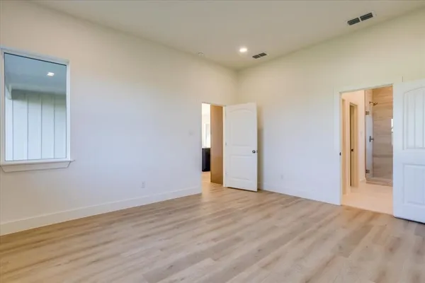 a bathroom with a double vanity sink mirror and shower