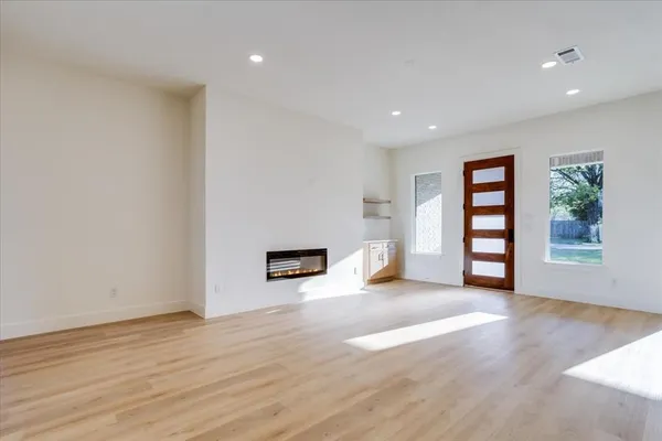 a view of kitchen with cabinets and wooden floor