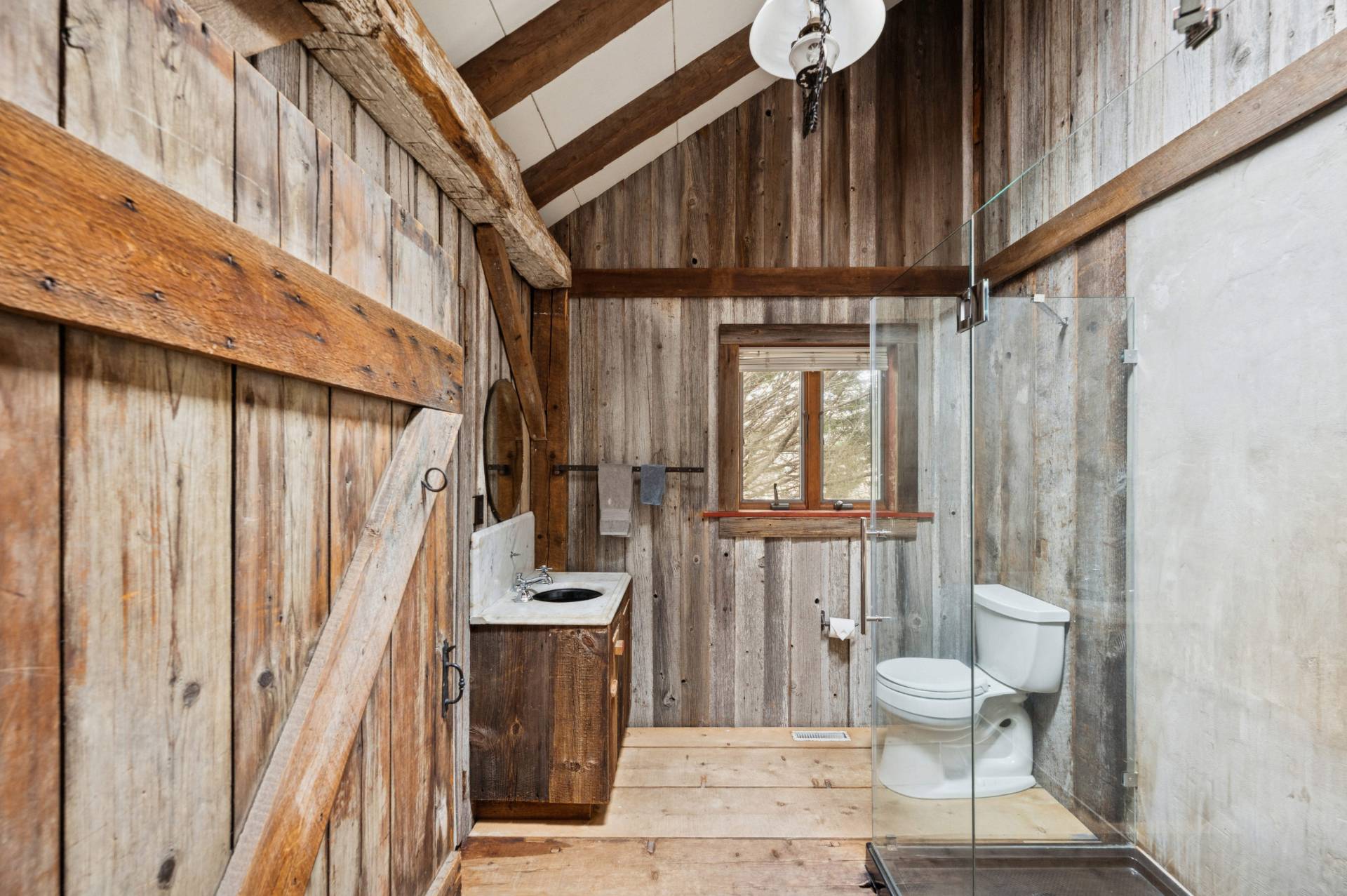 109 7 Ponds Road Water Mill, NY 11976 - Photo 15 of 32 a view of a hallway with wooden floor and staircase