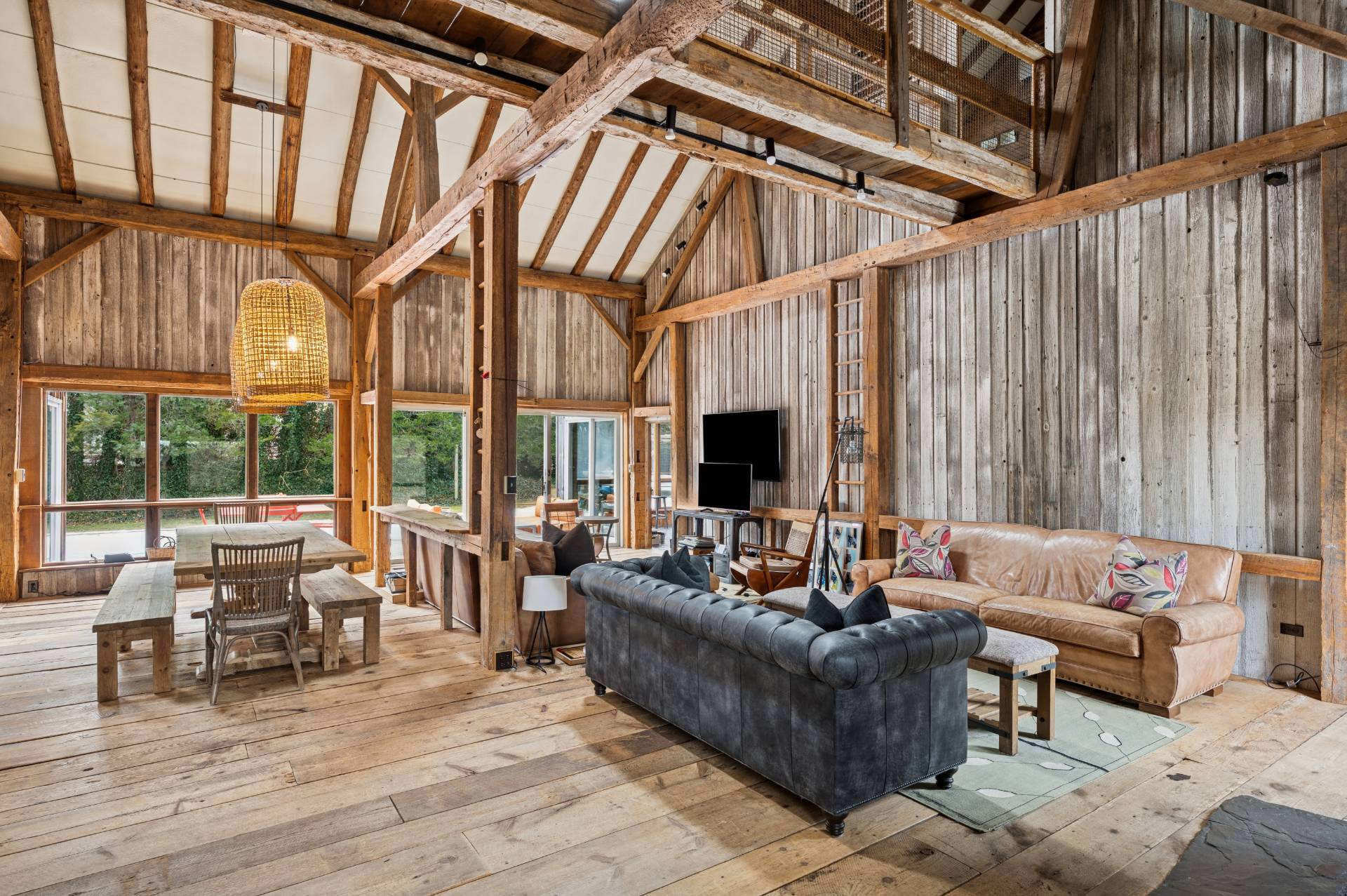 109 7 Ponds Road Water Mill, NY 11976 - Photo 4 of 32 a living room with furniture and a flat screen tv