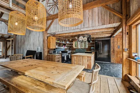 a view of a dinning tables and dinning room with furniture