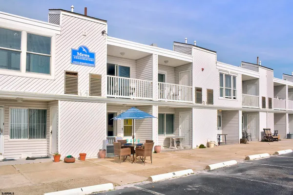a front view of a building with outdoor space