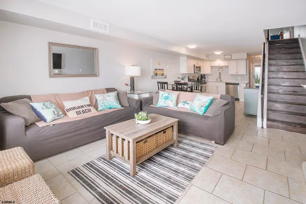 a living room with furniture and a table