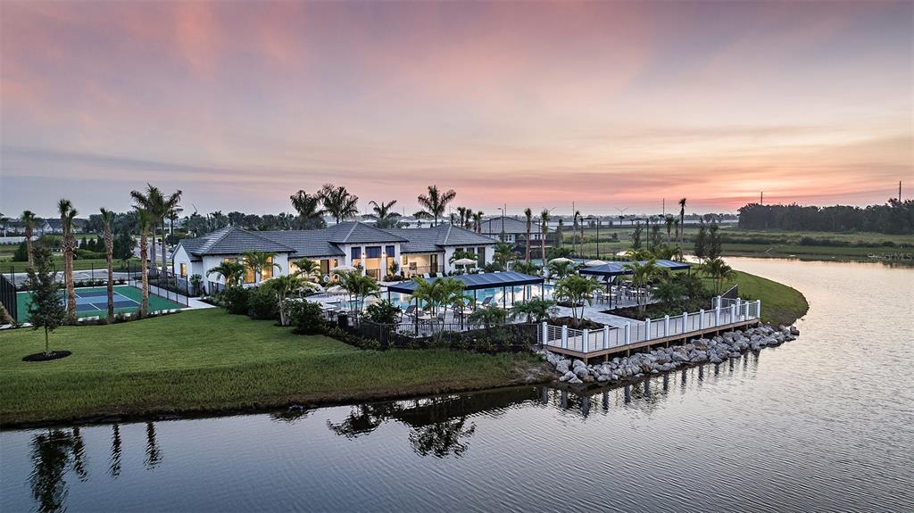18156 Cherished Loop Lakewood Ranch, FL 34211 - Photo 21 of 21 a view of a lake with a house in the background