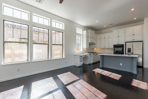 a kitchen with a sink cabinets and window
