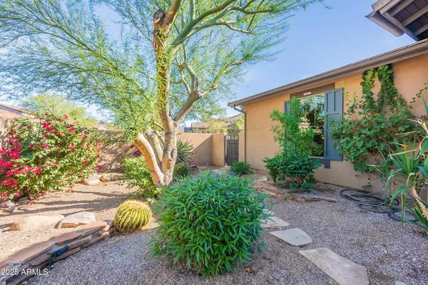 a front view of a house with a yard and a garage