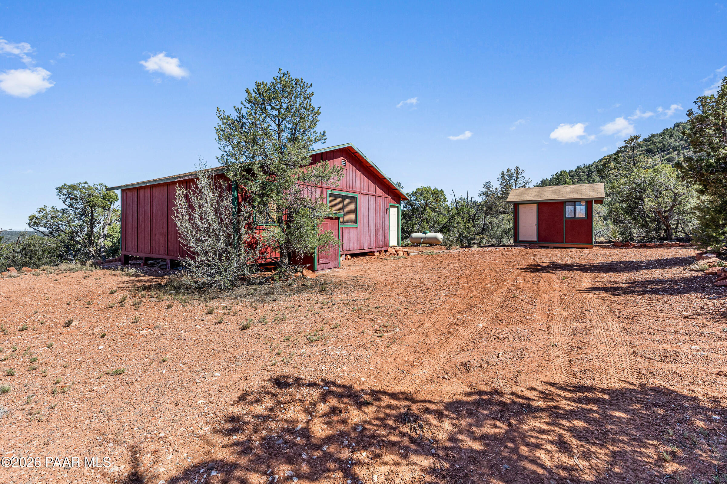 33749 West Whiskey River Road, Unit 21 Seligman, AZ 86337 - Photo 23 of 41 a view of a house with a yard and plant