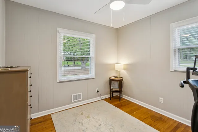 a view of a room with gym equipment and a window