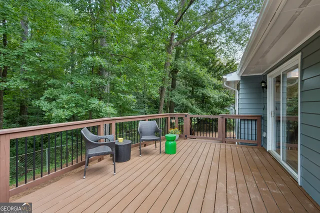a view of balcony with furniture and wooden floor