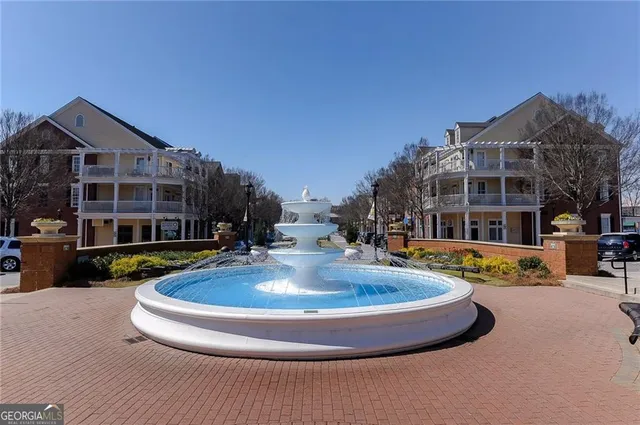 a view of a house with outdoor space and sitting area