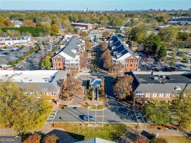 an aerial view of a houses with a lake view