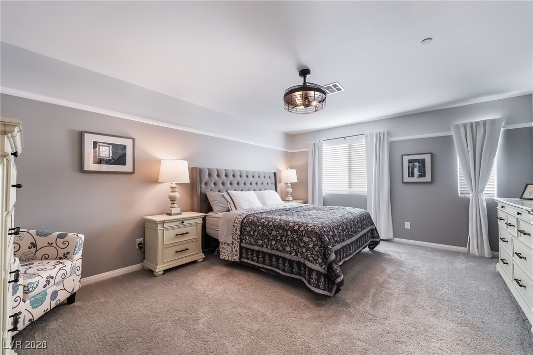 12235 Glass Desert Road, Unit 2 Las Vegas, NV 89183 - Photo 14 of 33 Bedroom with light colored carpet