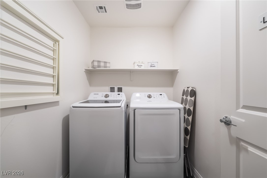 12235 Glass Desert Road, Unit 2 Las Vegas, NV 89183 - Photo 27 of 33 Washroom featuring independent washer and dryer