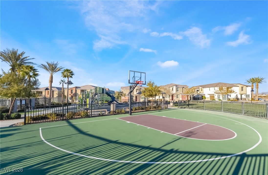 12235 Glass Desert Road, Unit 2 Las Vegas, NV 89183 - Photo 31 of 33 View of sport court featuring a residential view and community basketball court