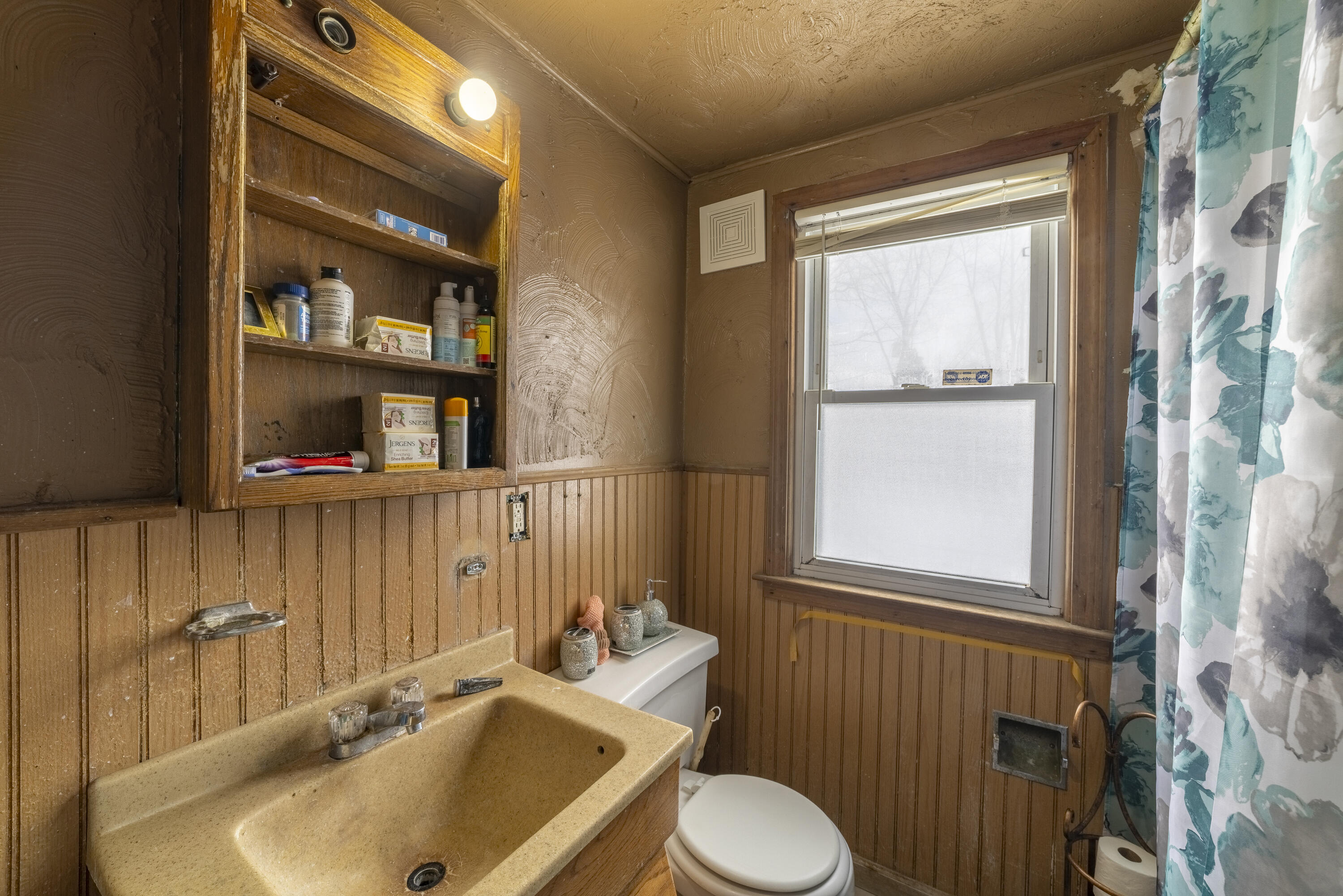 132 Hendricks Street Michigan City, IN 46360 - Photo 15 of 21 a bathroom with a sink toilet and shower