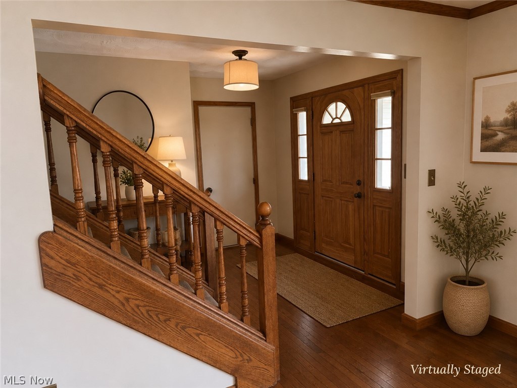 6416 Ridgeview Avenue Youngstown, OH 44515 - Photo 5 of 15 Hardwood entry with a solid wood front door, decorative arch window, and sidelight windows