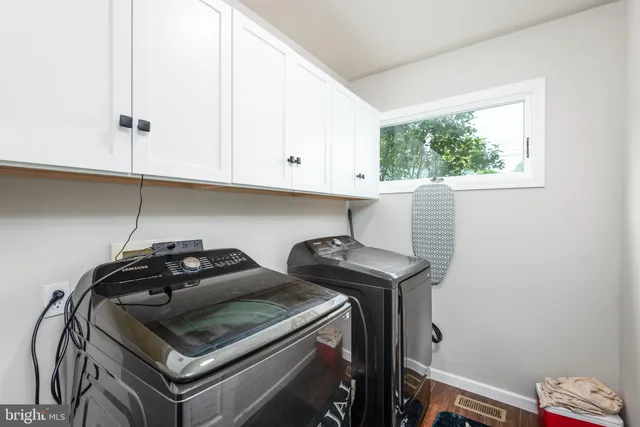 a kitchen with a stove and a window