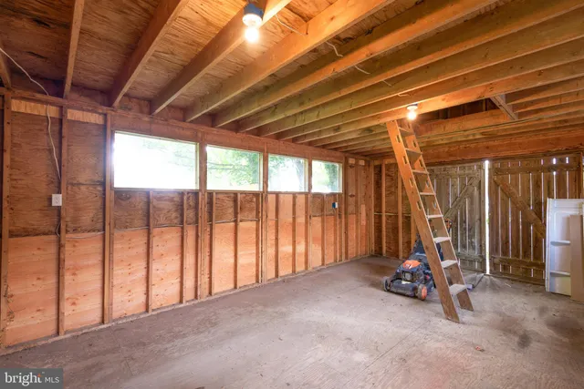 a view of a room with wooden walls