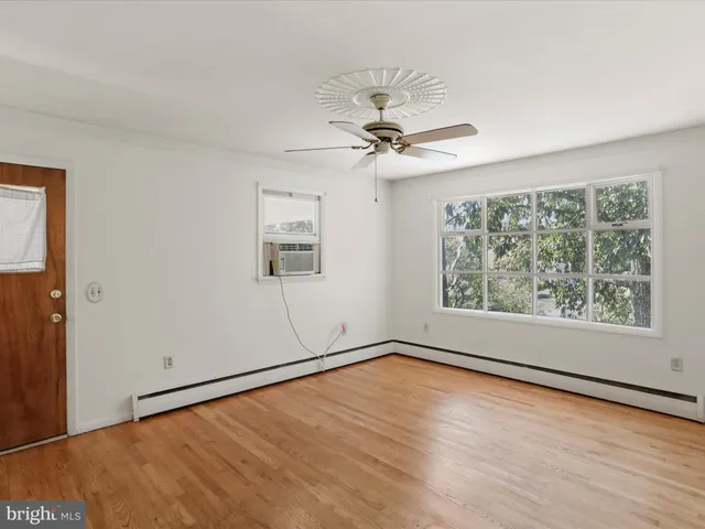 a view of an empty room with a window