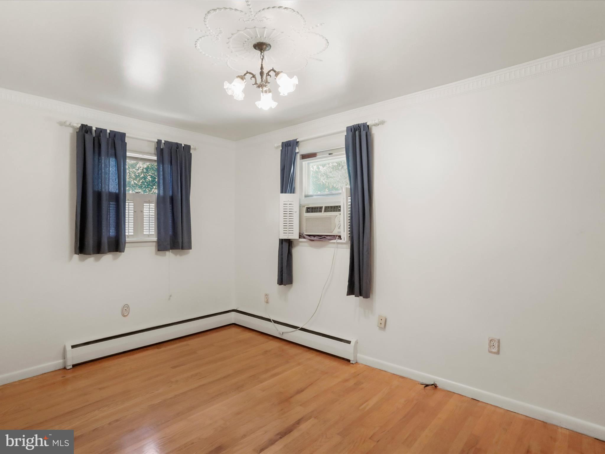 810 Winifred Road Cumberland, MD 21502 - Photo 17 of 45 a view of an empty room with window and wooden floor