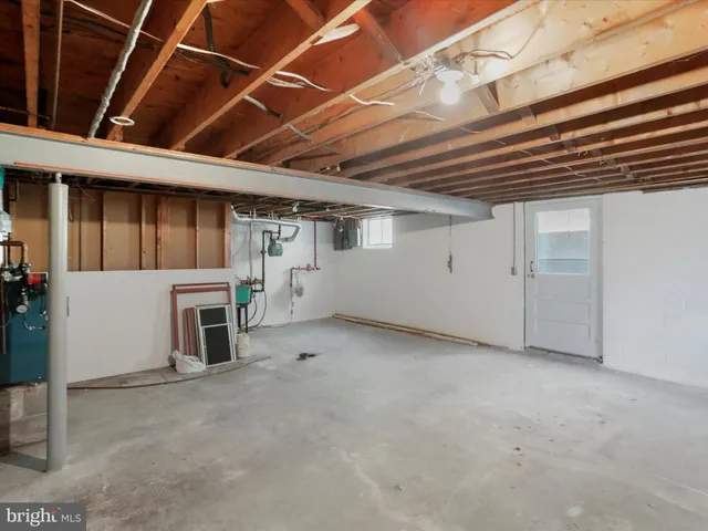 a view of a livingroom with fireplace and furniture