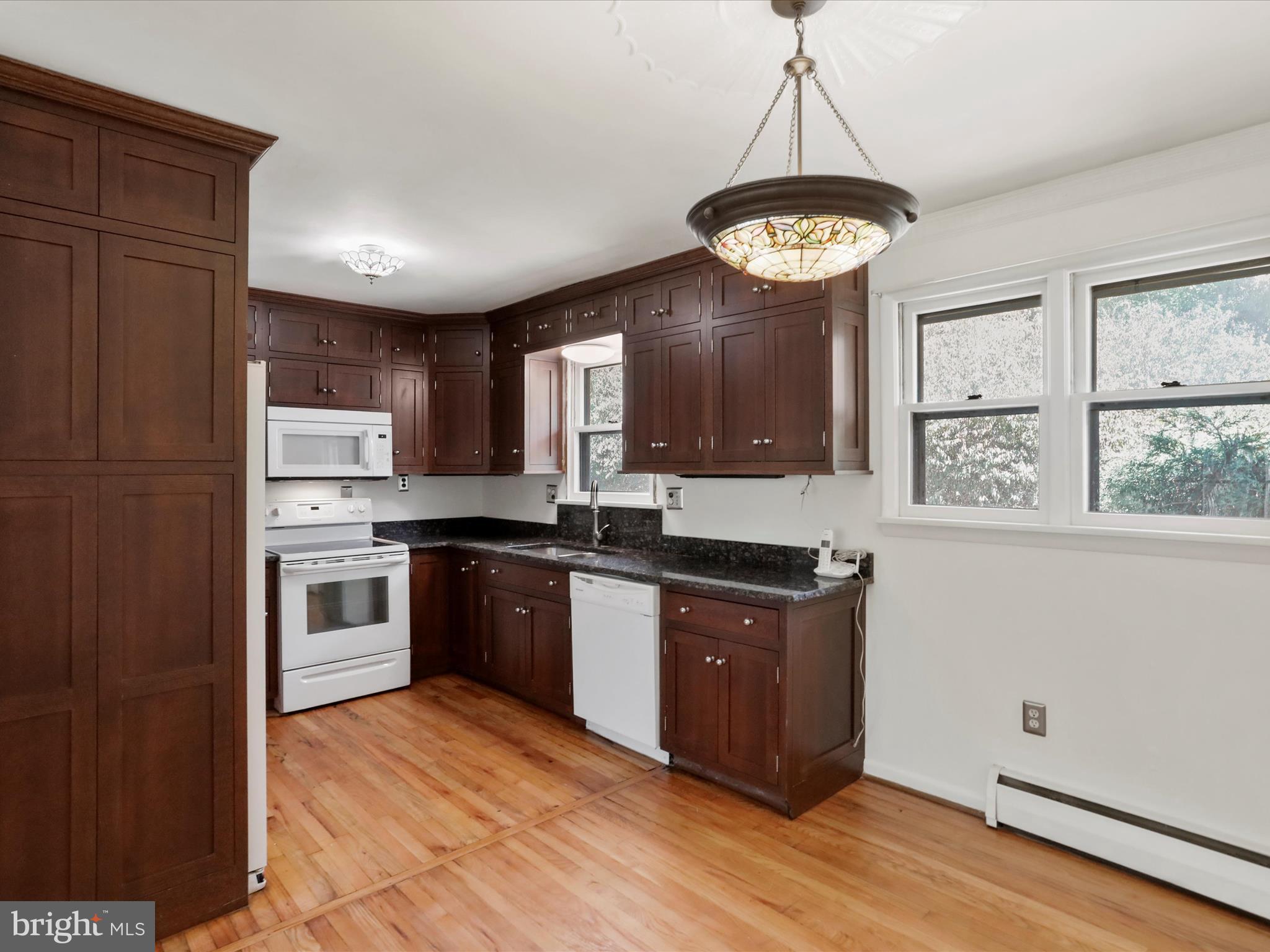810 Winifred Road Cumberland, MD 21502 - Photo 5 of 45 a kitchen with stainless steel appliances granite countertop a stove a sink dishwasher and a refrigerator with wooden floor