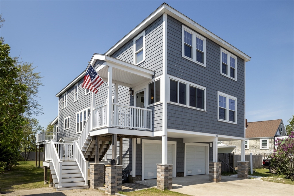 67 Newport Road Hull, MA 02045 - Photo 1 of 26 a front view of a house with a yard