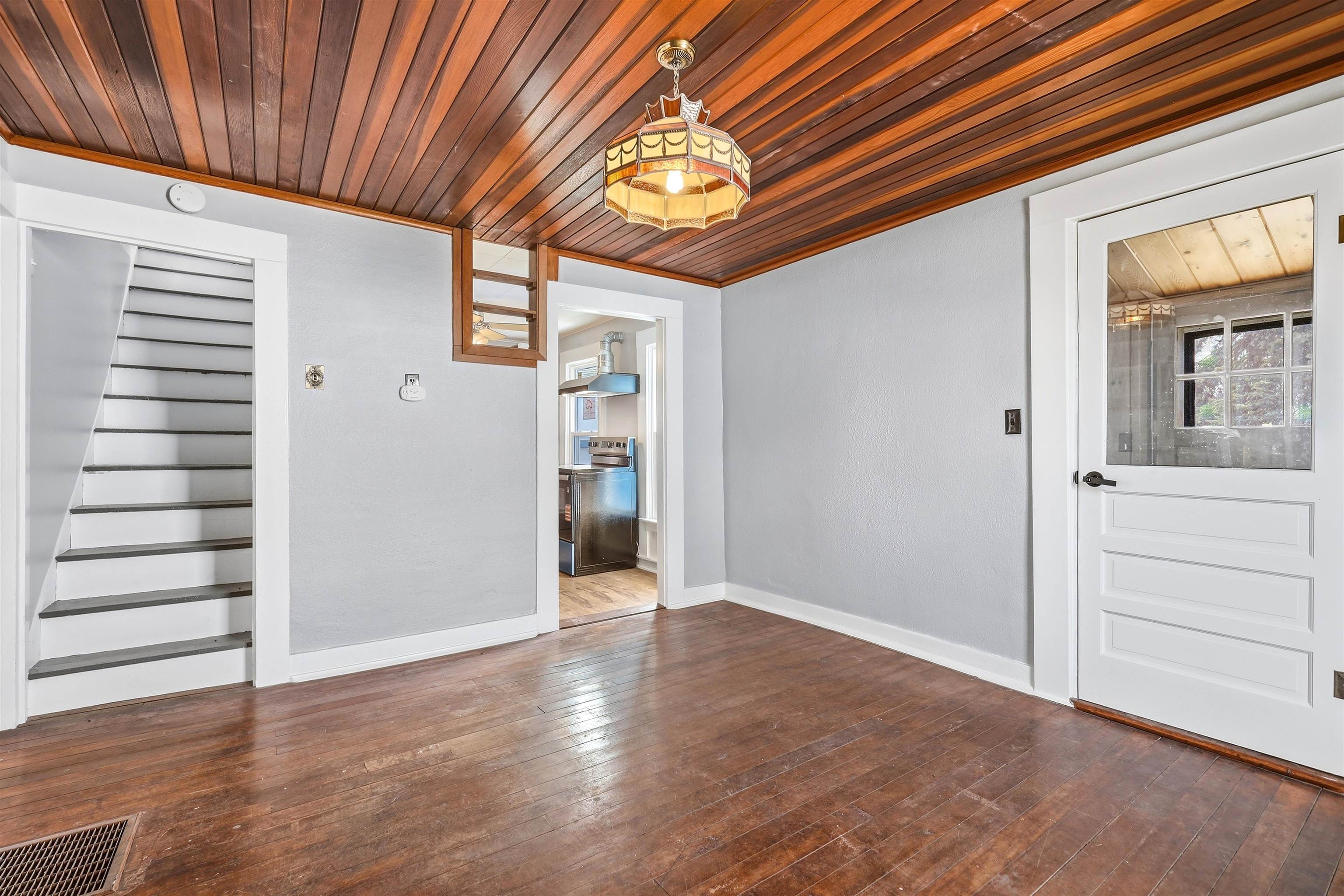 409 South Water Street Warren, IL 61087 - Photo 13 of 29 an empty room with wooden floor closet and windows