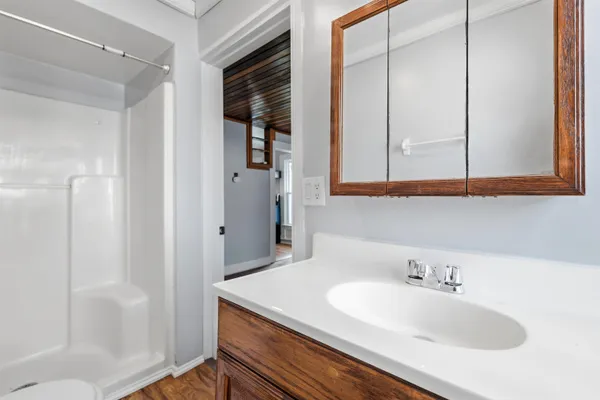 a bathroom with a sink and a mirror