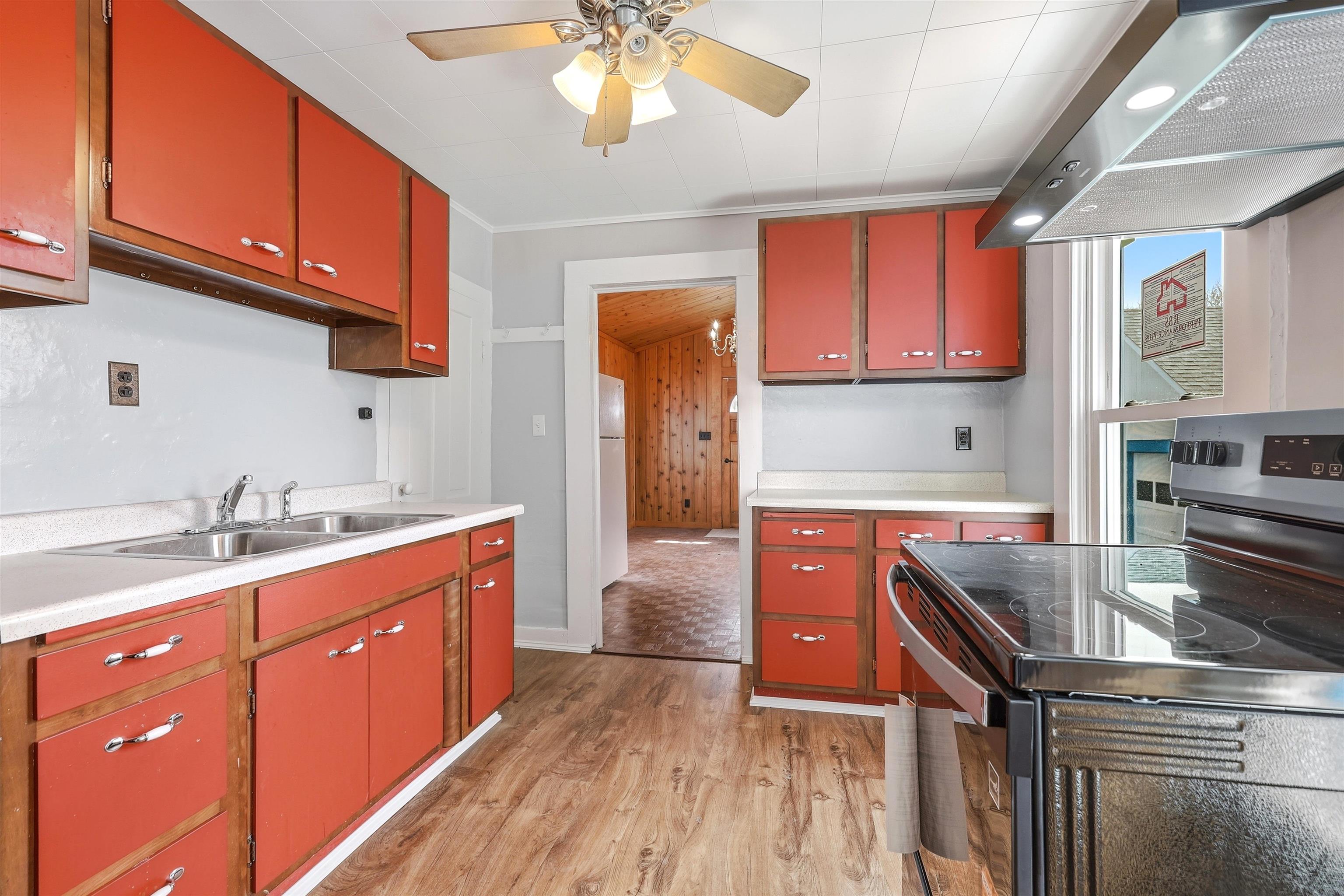 409 South Water Street Warren, IL 61087 - Photo 16 of 29 a kitchen with stainless steel appliances granite countertop a sink stove and cabinets