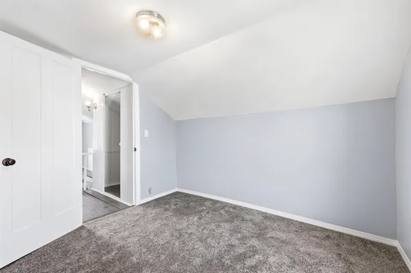 a view of hallway with wooden floor