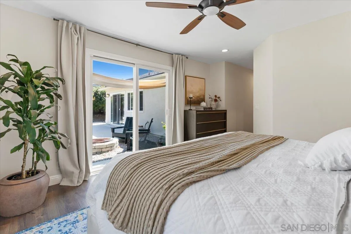 12243 Buckskin Trail Poway, CA 92064 - Photo 33 of 41 a bedroom with a bed and a potted plant