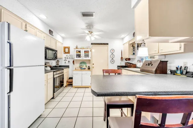a view of a hallway with wooden floor and entryway