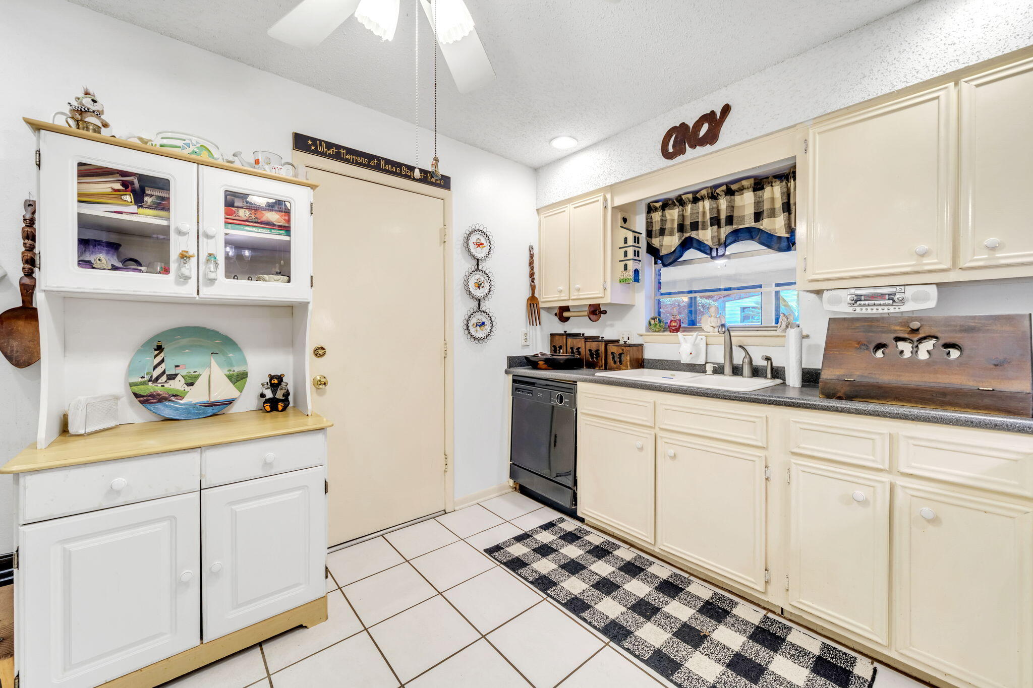 504 Kelly Street Destin, FL 32541 - Photo 16 of 92 a kitchen with stainless steel appliances a sink and cabinets