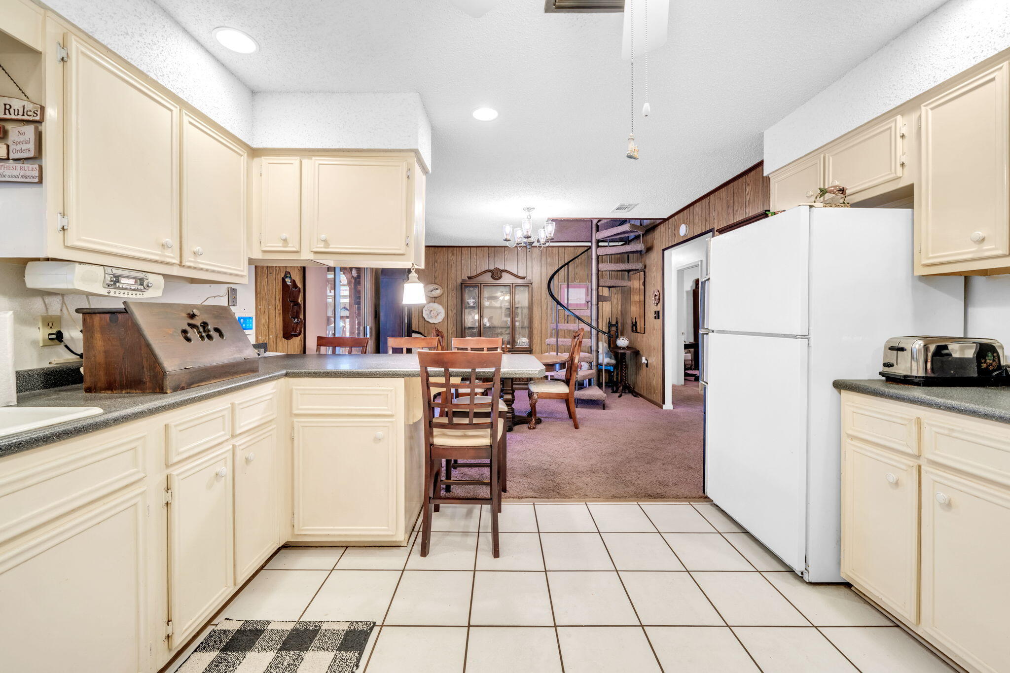 504 Kelly Street Destin, FL 32541 - Photo 18 of 92 a kitchen with stainless steel appliances a refrigerator sink and cabinets