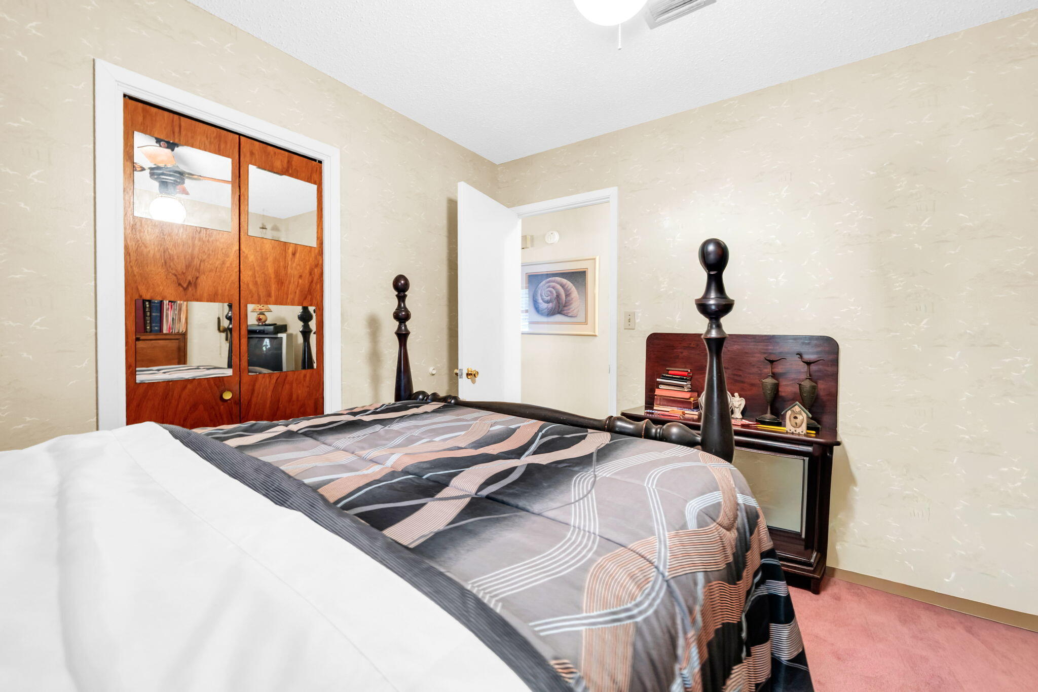 504 Kelly Street Destin, FL 32541 - Photo 29 of 92 a bedroom with a bed and wooden floor