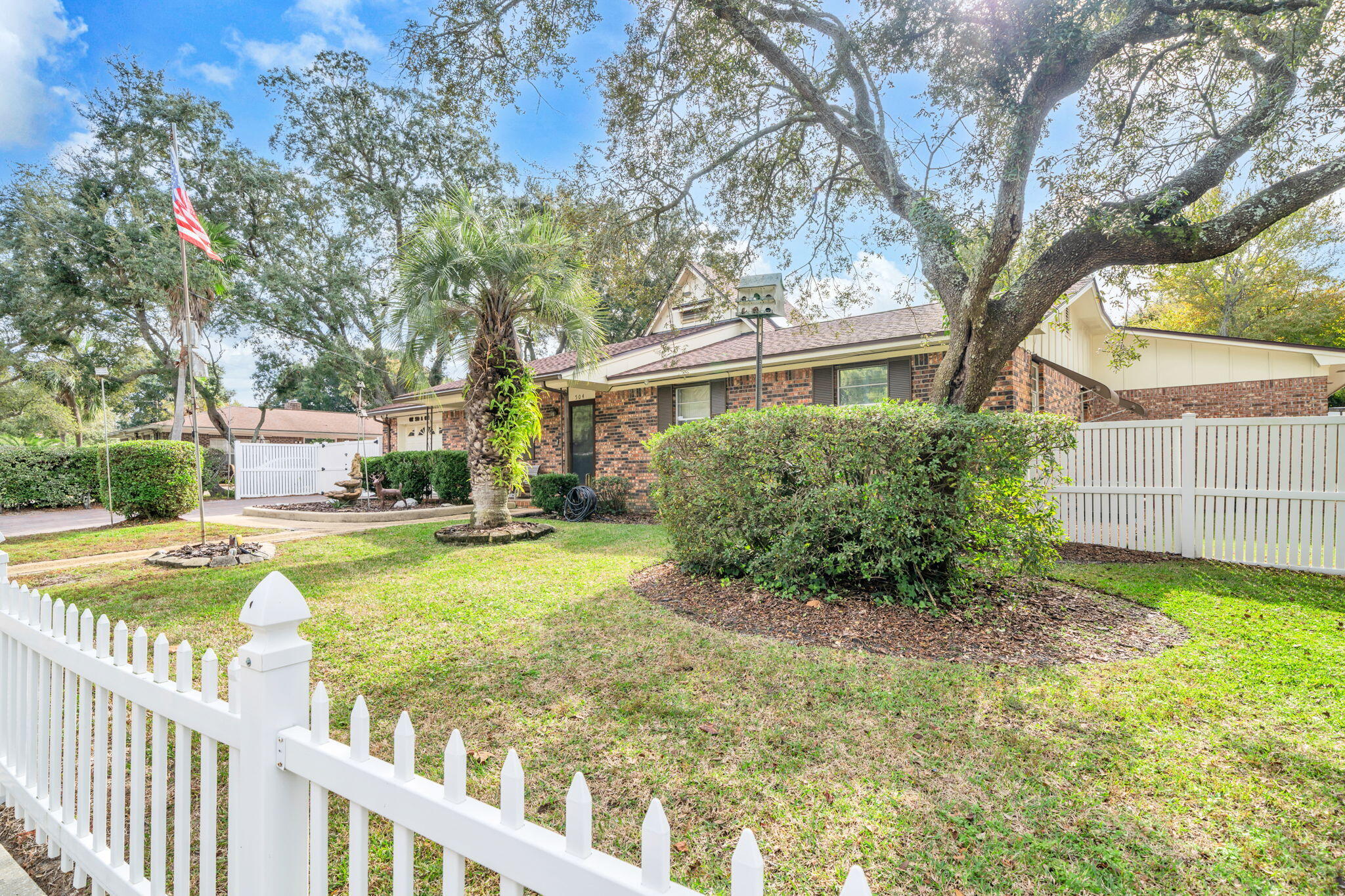 504 Kelly Street Destin, FL 32541 - Photo 3 of 92 a view of a house with backyard and sitting area