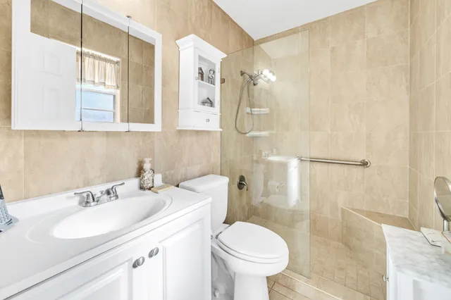 a view of a house with a yard and tree s