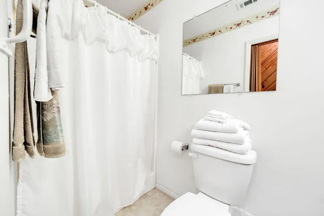 a view of swimming pool with a patio