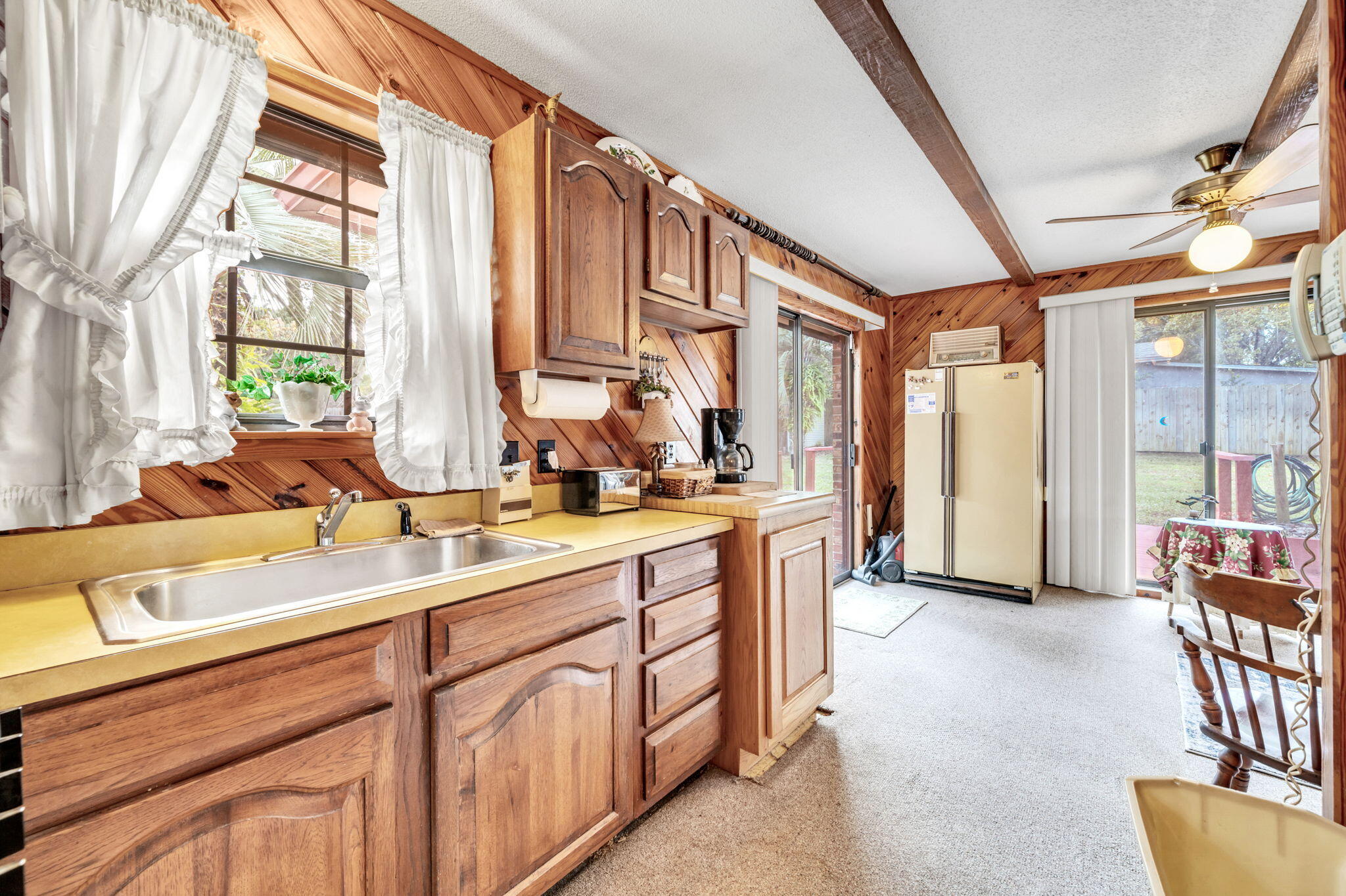504 Kelly Street Destin, FL 32541 - Photo 39 of 92 a spacious bathroom with a double vanity sink and a large mirror