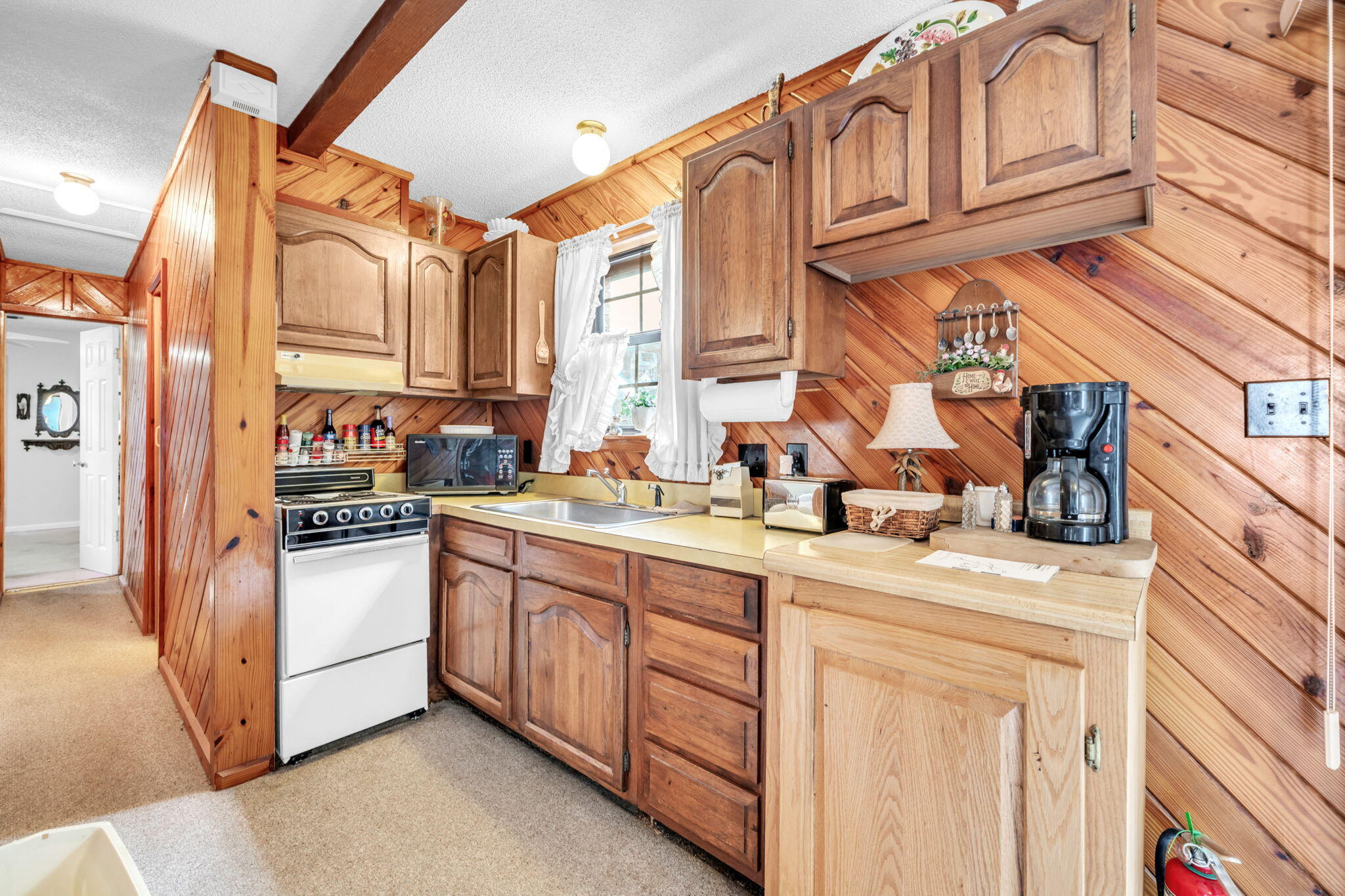 504 Kelly Street Destin, FL 32541 - Photo 40 of 92 a kitchen with stainless steel appliances granite countertop a sink and a refrigerator